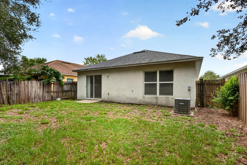 Backyard view with fenced yard at 7329 Lawn Tennis Ln, Jacksonville, FL