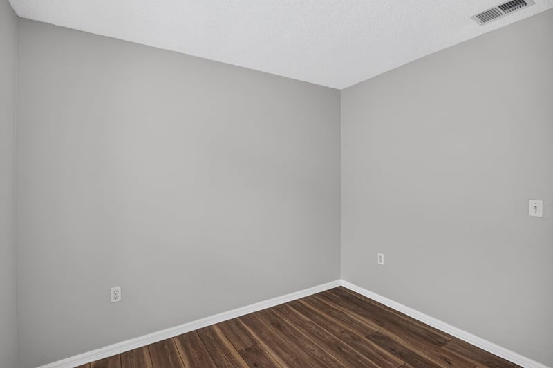 Bedroom with wood-look flooring at 7329 Lawn Tennis Ln, Jacksonville, FL