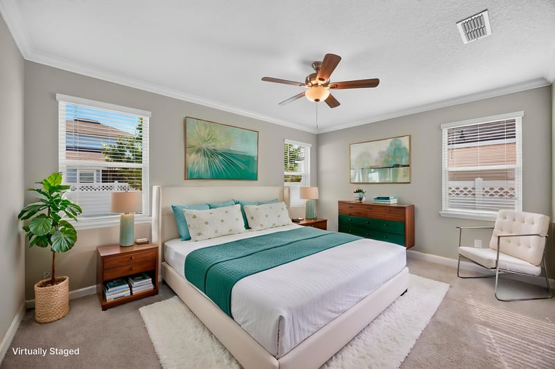 Bedroom with teal bedding, virtually staged, at 331 Millerstone Dr, St. Augustine, FL 32092