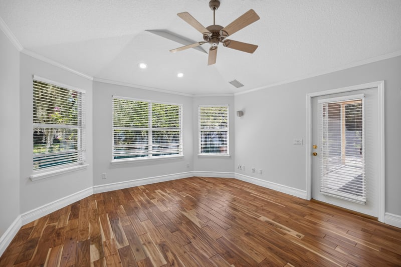 Primary bedroom panorama with door to the porch at 11675 Magnolia Estates Rd, Jacksonville, FL 32223