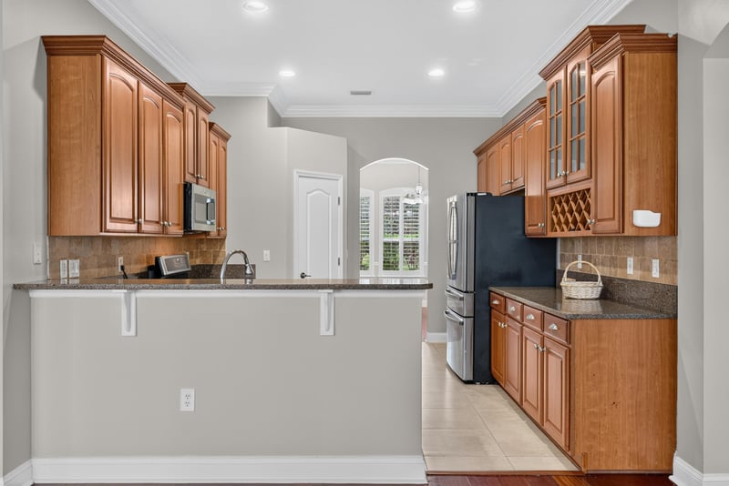Kitchen with wood cabinets, island and stainless appliances at 4109 Eagle Landing Pkwy, Orange Park, FL 32065