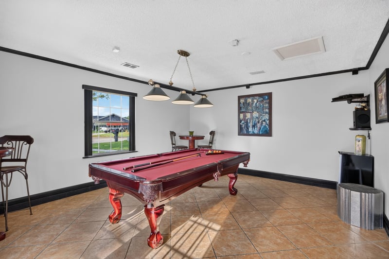 Game room with pool table at 6931 Cane Grass Ln E, Jacksonville, FL 32244
