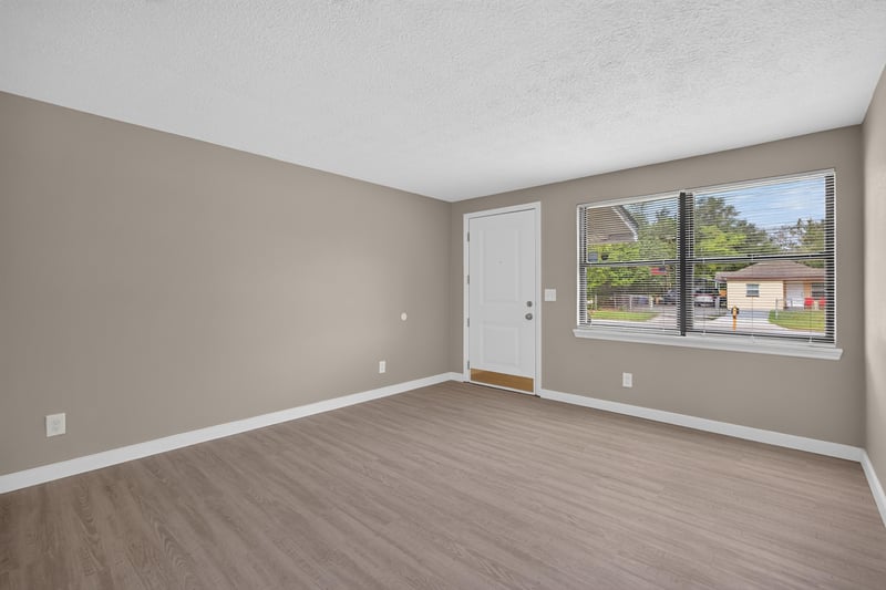 Empty room with window and exterior door at 184 Draco St, Orange Park, FL 32073