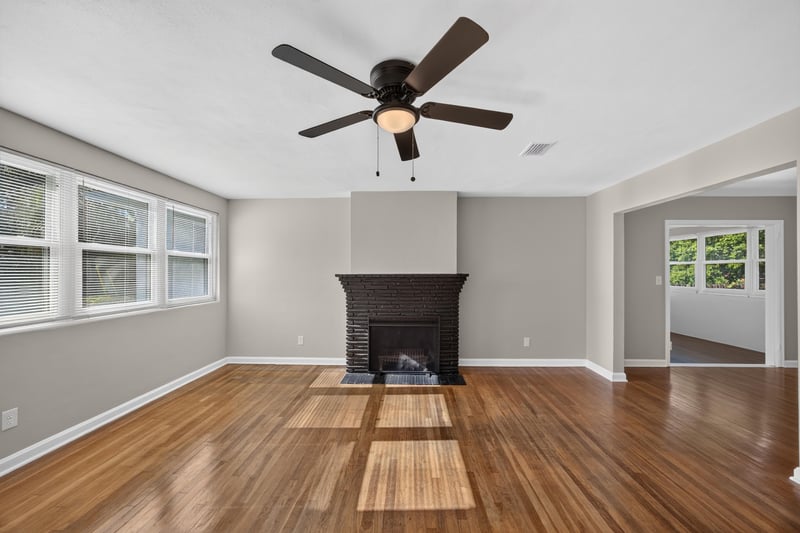 Living room with hardwood floors and fireplace at 6338 Mercer Cir W, Jacksonville, FL