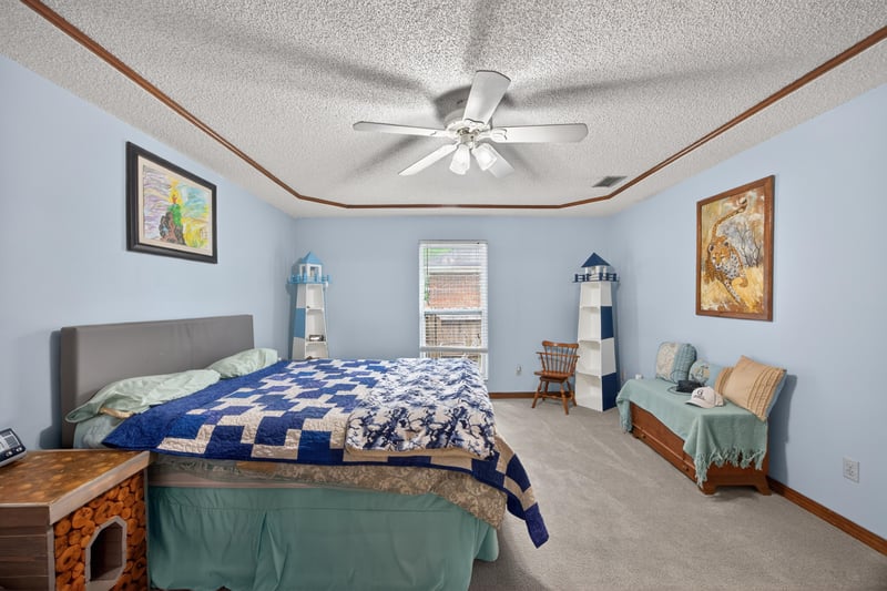 Bedroom with nautical decor and quilted bedspread at 981 Marble Ridge Dr, Orange Park, FL 32065