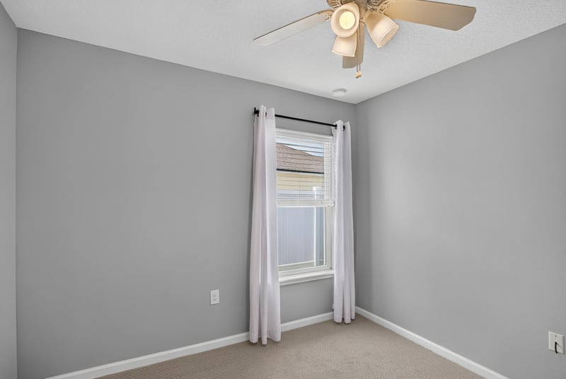 Empty carpeted room with curtains at 85 Amia Dr, St. Augustine, FL 32086