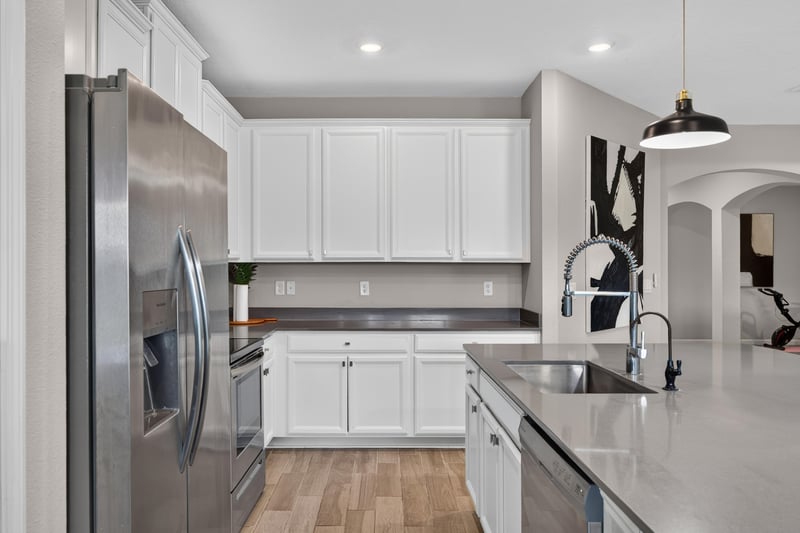 Kitchen sink area with stainless appliances at 9942 Lovage Ln, Jacksonville, FL 32219
