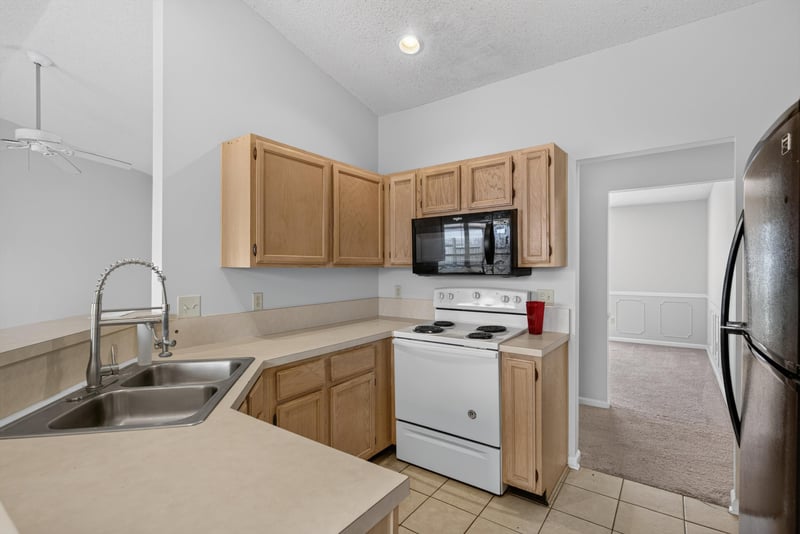 Kitchen sink with white range at 400 Ashcroft Landing Dr, Jacksonville, FL 32225