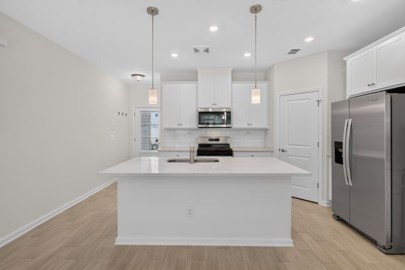 Kitchen with island and pendant lights at 39 Mellowood Ln, St. Augustine, FL 32092