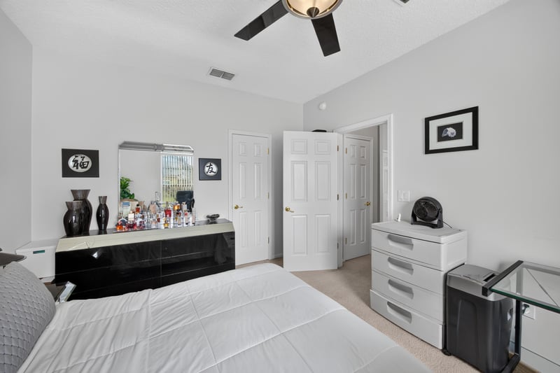 Bedroom with mirrored dresser at 2875 Pebblewood Ln, Orange Park, FL 32065