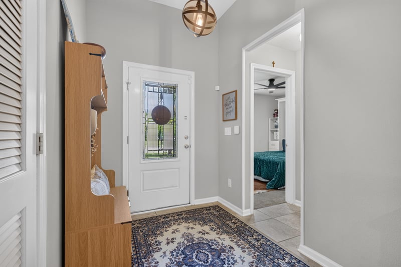 Front door interior view with tile flooring at 589 Seville Pkwy, St. Augustine, FL