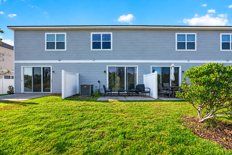 Rear exterior with fenced yard and patio at 339 Anthony Dr, Jacksonville, FL
