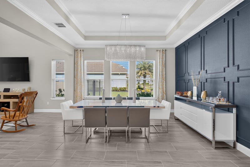 Dining room with tray ceiling and chandelier at 22 Azura Point