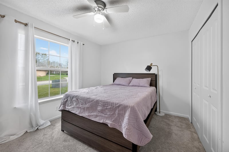 Bedroom with bed and large window at 8921 Needlepoint Pl, Jacksonville, FL 32244