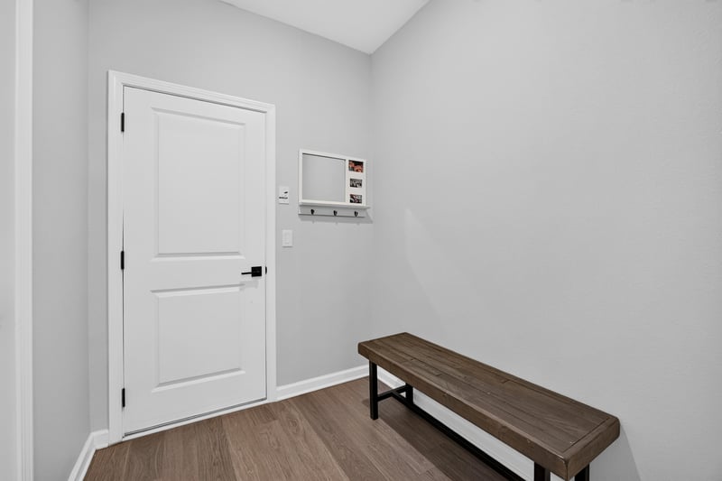 Entry hallway with bench and wall storage at 2354 Jennings Farm Dr, Middleburg, FL 32068