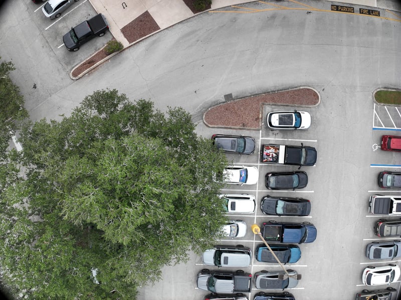 Aerial view of parking lot and landscaped curve at 9406 Atlantic Blvd, Jacksonville, FL 32225
