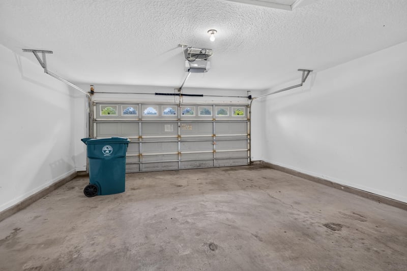 Garage interior with carriage-style door at 11669 Collins Creek Dr, Jacksonville, FL 32258