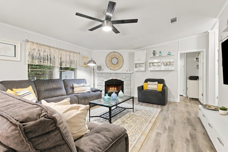 Living room with fireplace, photographed by Megapixeler on Secret Cove Rd, Middleburg, FL