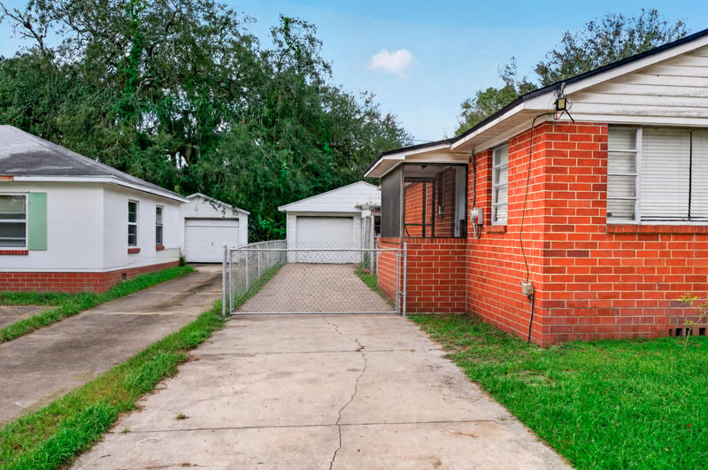Side exterior view with concrete driveway at 450 E 46th St, Jacksonville, FL 32208