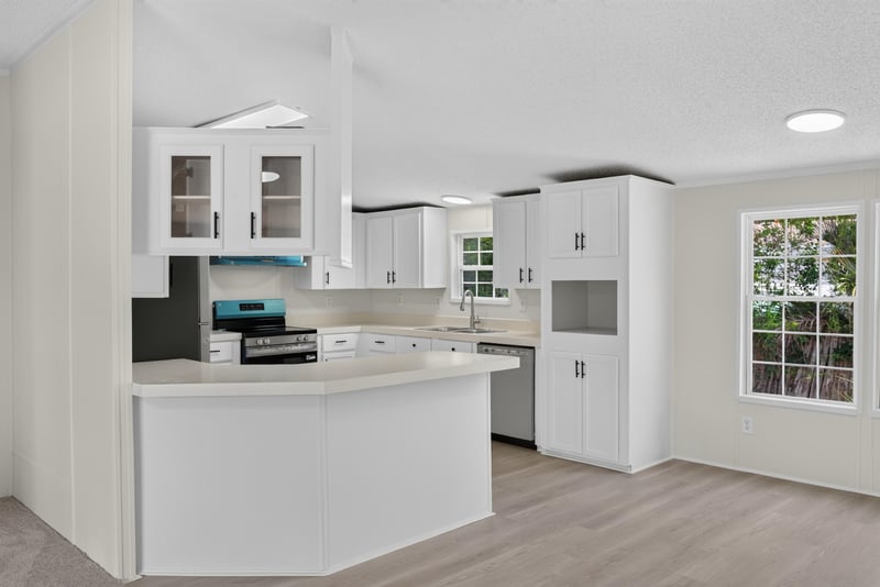 Kitchen cabinets with window above counter at 7603 Coach Park Dr, Jacksonville, FL 32244