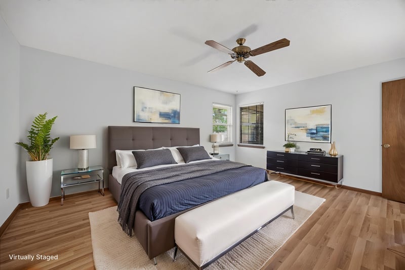 Primary bedroom staged with gray bed and nightstands at 2460 San Sago Ln, Jacksonville, FL