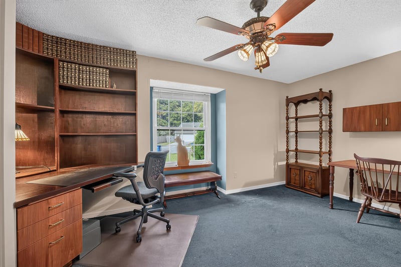 Home office with built-in shelving at 4837 Pareja Ct, Jacksonville, FL 32225