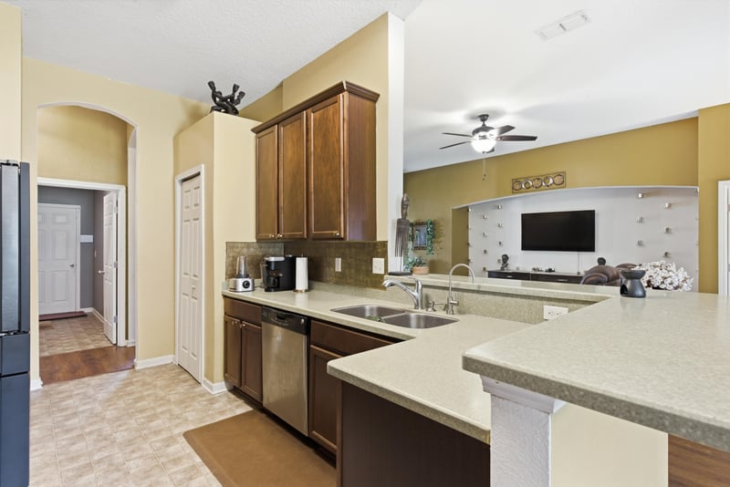 Kitchen with granite counters and pendant lighting at 7392 Timber Falls Ct