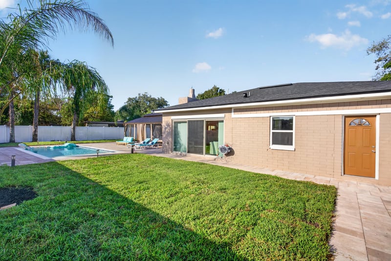 Backyard exterior with pool and patio at 1525 8th St N, Jacksonville Beach, FL