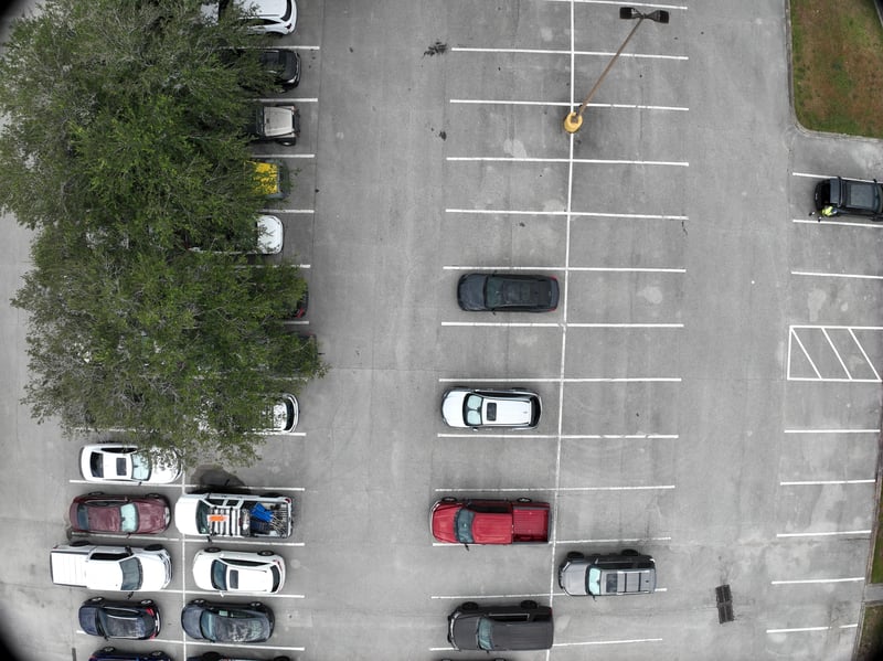 Aerial view of parking rows and tree canopy at 9406 Atlantic Blvd, Jacksonville, FL 32225