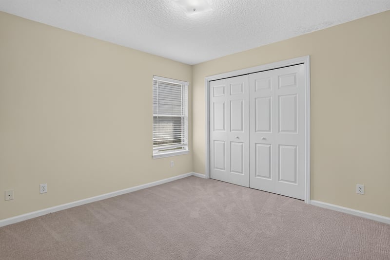 Bedroom with closet and window at 299 John's Creek Pkwy, St. Augustine, FL 32092