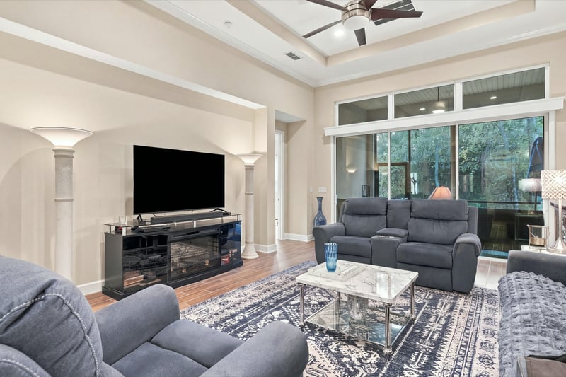 Living room with fireplace and TV, photographed by Megapixeler on Lucena Ln, Jacksonville, FL