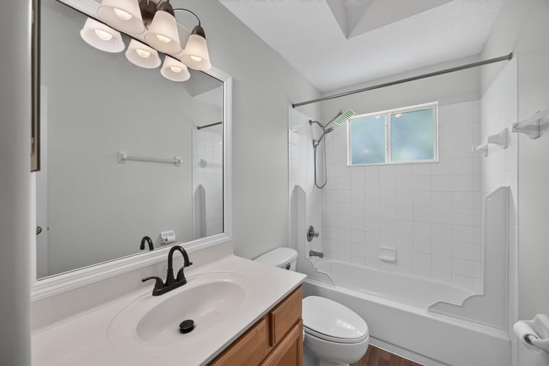 Bathroom with vanity mirror and shower at 2480 Ridge Will Dr, Jacksonville, FL 32246