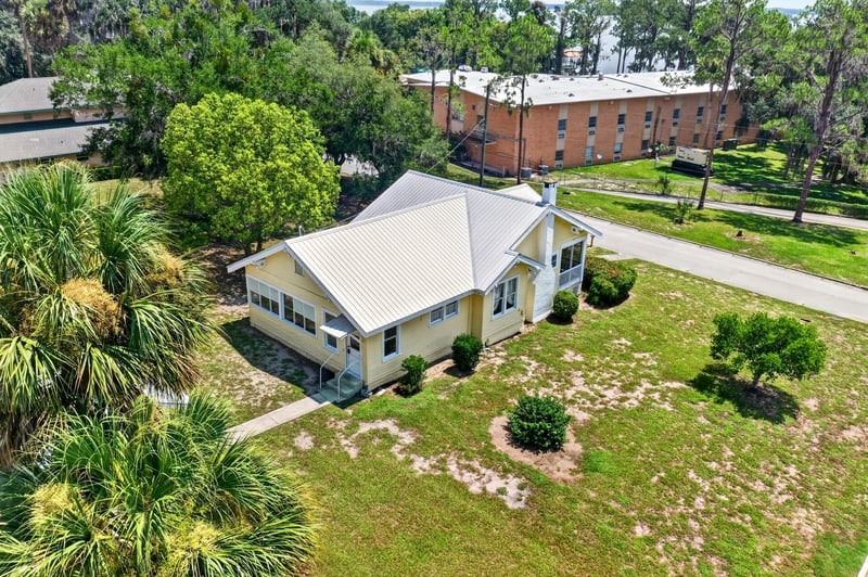 Rear exterior view with palm trees at 101 N Lake St, Crescent City, FL