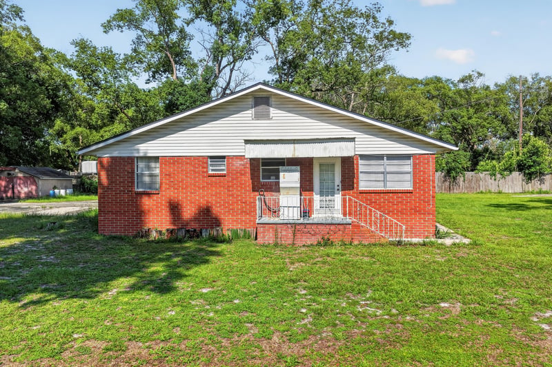 Front exterior with covered porch at 5745 110th St, Jacksonville, FL 32244