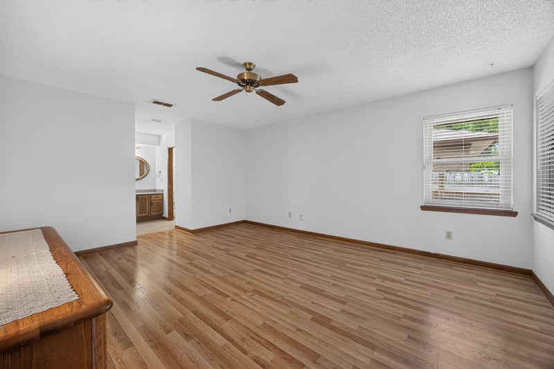 Empty room with wood floor and two windows at 2460 San Sago Ln, Jacksonville, FL