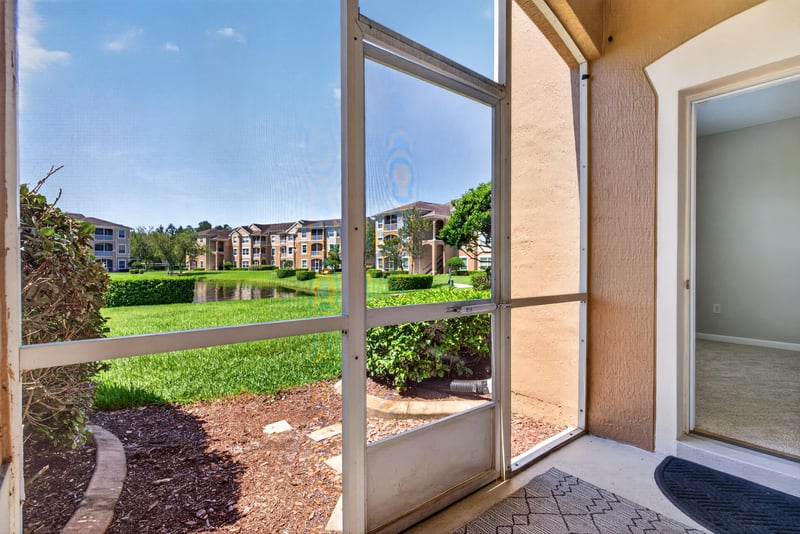 Screened porch with brick pavers at 7990 Baymeadows Rd E #404, Jacksonville, FL 32256
