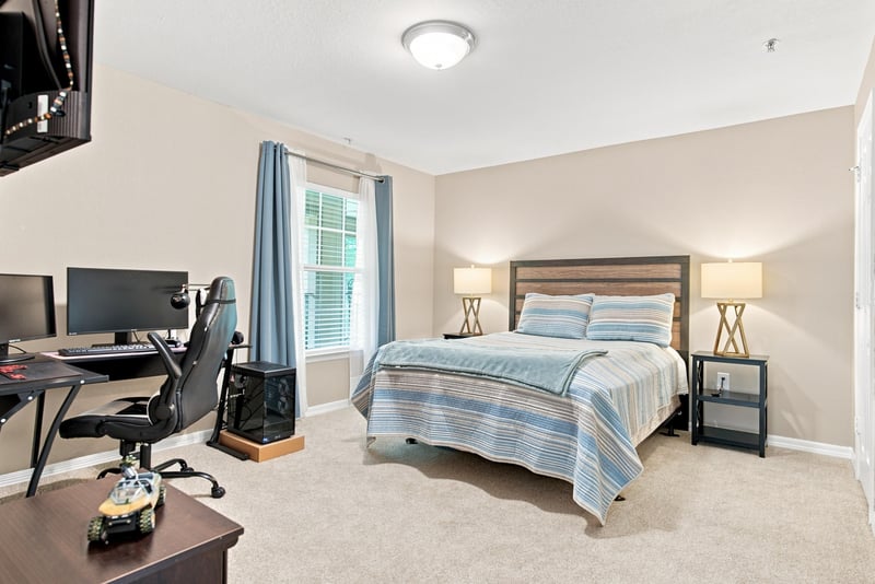 Bedroom with desk and computer setup at 7800 Point Meadows Dr, Jacksonville, FL 32256