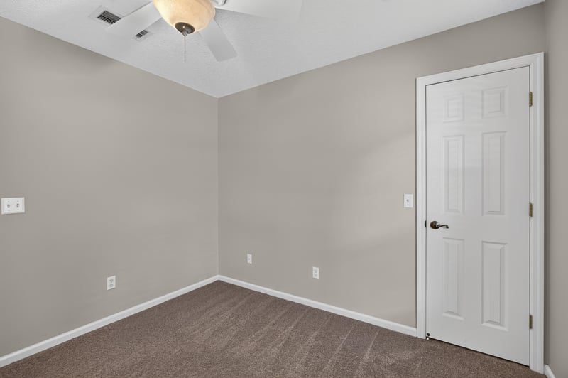 Empty bedroom with door at 1955 GUARDED Way, Fleming Island, FL 32003