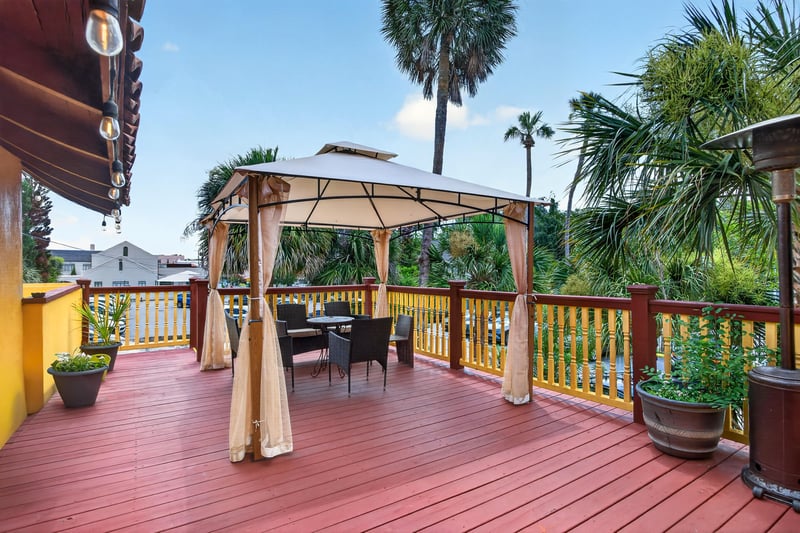 Rooftop deck with gazebo seating and string lights at 115 Cordova St, St. Augustine, FL