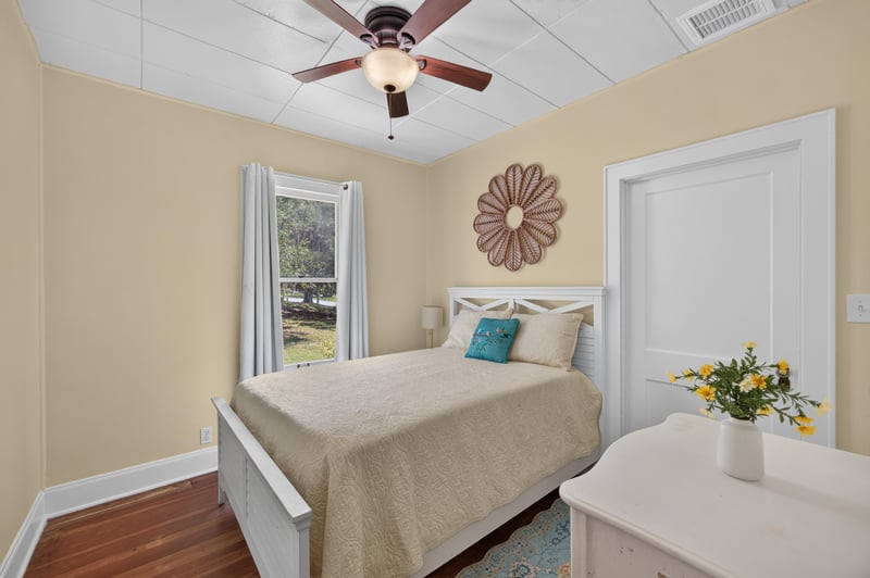 Bedroom with bed and ceiling fan at 101 N Lake St, Crescent City, FL