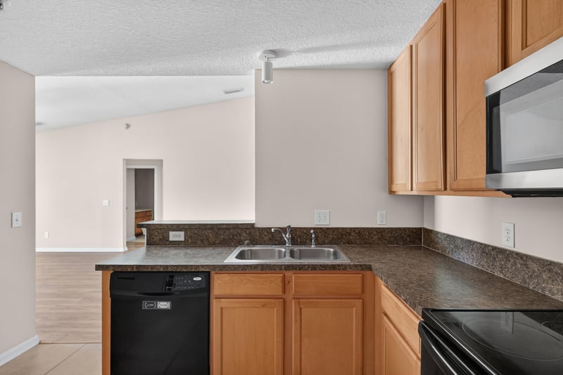 Kitchen sink and dishwasher view at 7047 Deer Lodge Cir, Jacksonville