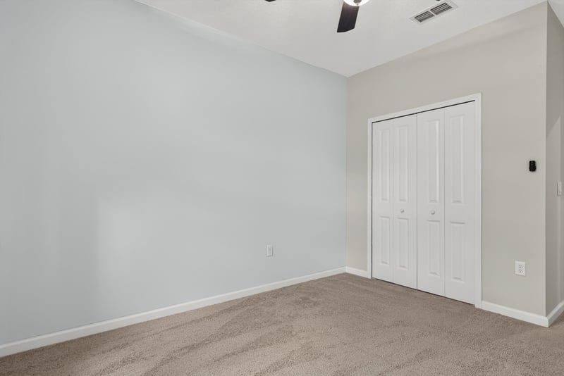 Carpeted room with closet door at 2378 Caney Oaks Dr, Jacksonville, FL