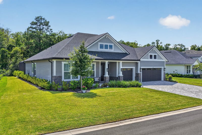 Aerial front view of the roofline and front lawn at 785 Back Creek Dr, St. Augustine, FL 32092