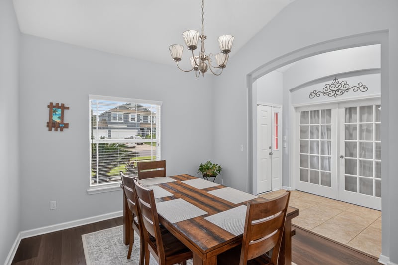 Dining room with windows and arched doorway at 538 Porta Rosa Circle, St. Augustine, FL 32092