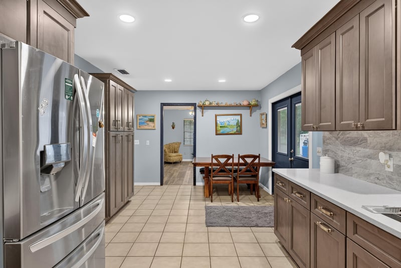Kitchen with stainless refrigerator and dining area view at 3249 Maryland Ave, Green Cove Springs, FL