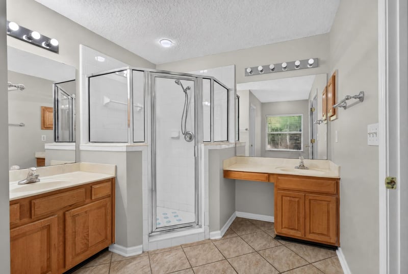 Bathroom with glass shower and double vanity at 11669 Collins Creek Dr, Jacksonville, FL 32258