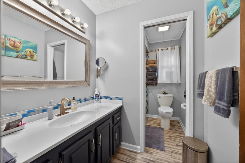 Bathroom vanity with mirror and tile floor at 981 Marble Ridge Dr, Orange Park, FL 32065