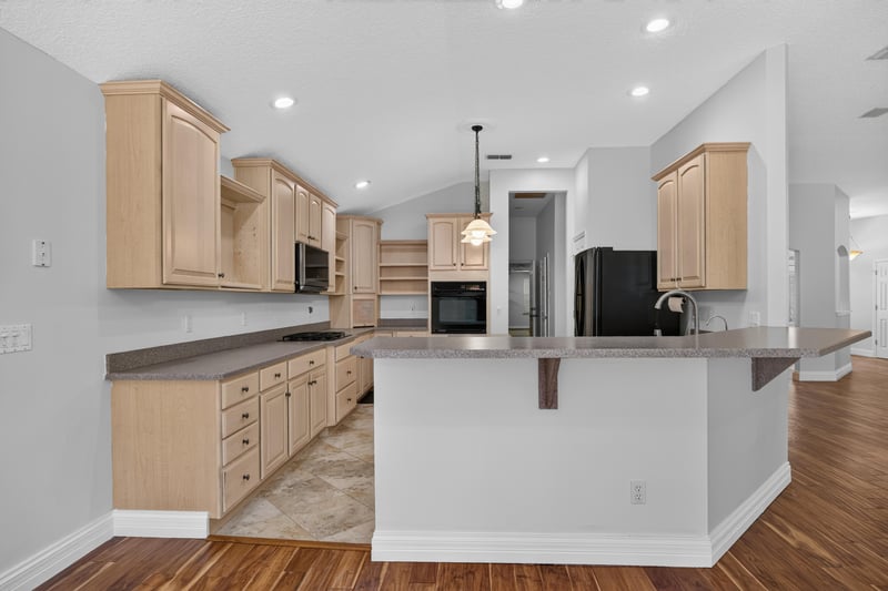 Kitchen with light wood cabinets and tile floor at 11675 Magnolia Estates Rd, Jacksonville, FL 32223