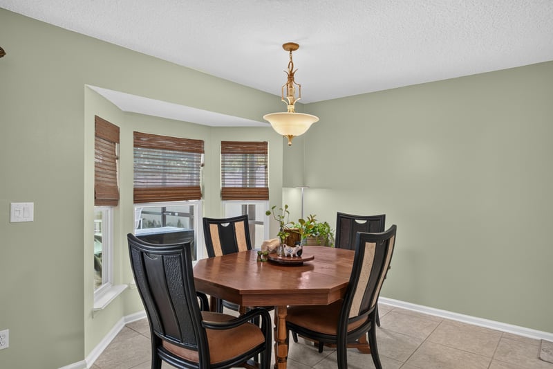 Dining table near bay window at 1589 Backwater Drive, Middleburg, FL 32068