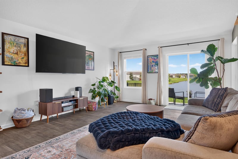 Living room with sofa and window view at 4276 Quaking St, Jacksonville, FL 32218